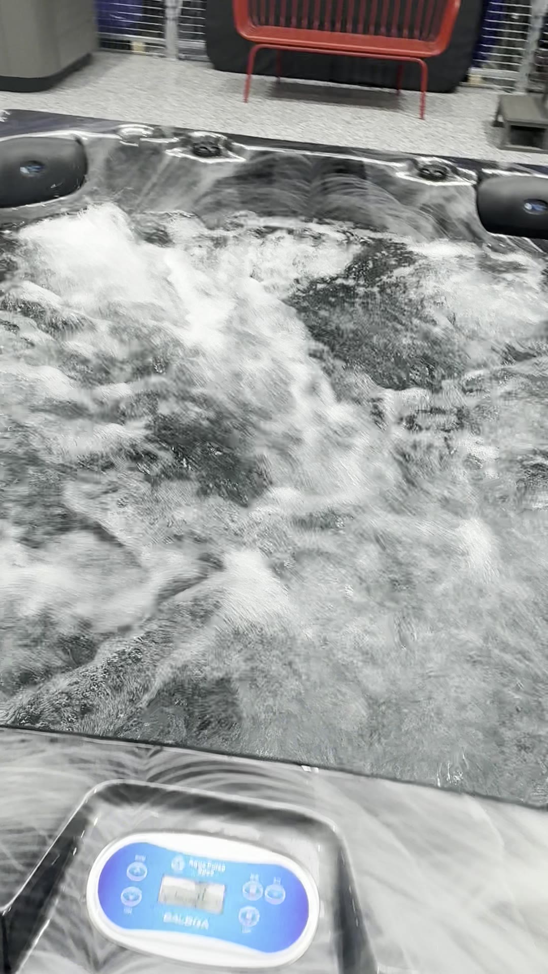 The Balboa control panel on a Manly Deluxe, with the moulded Aqua Pulse Spas badge
