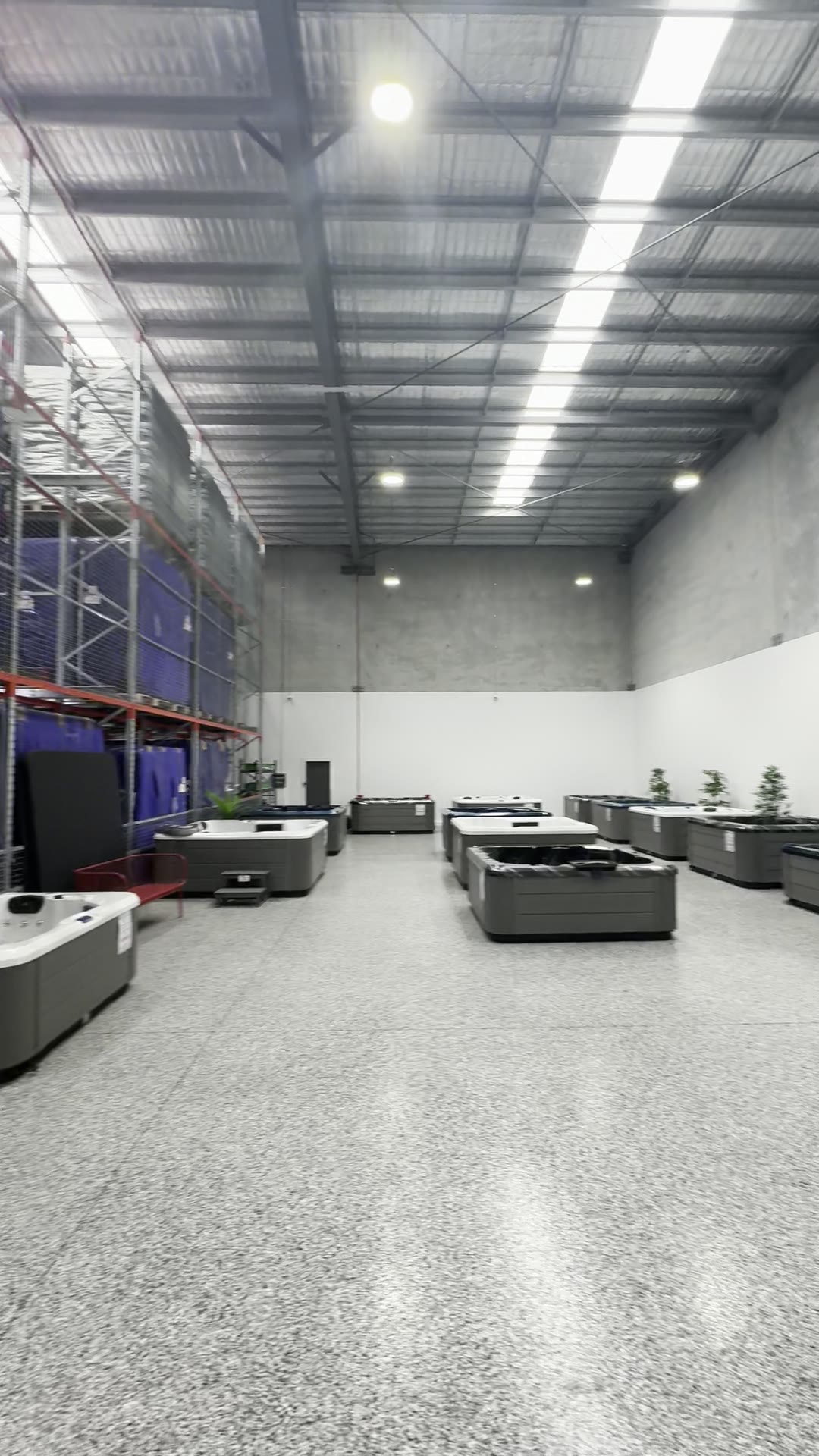 The Aqua Pulse Spas warehouse floor at Yatala, with spas on display