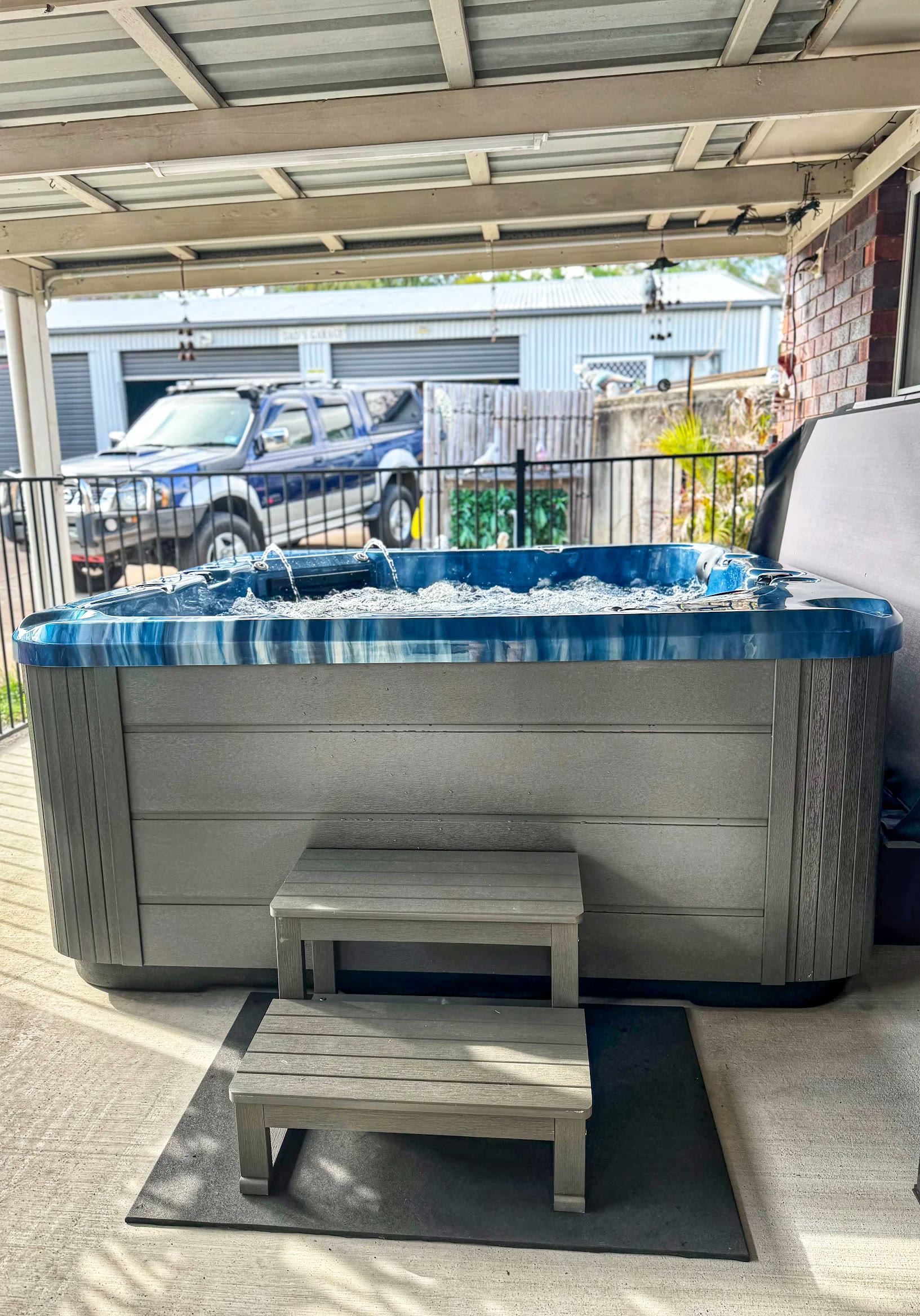 Blue-marble spa running waterfall jets