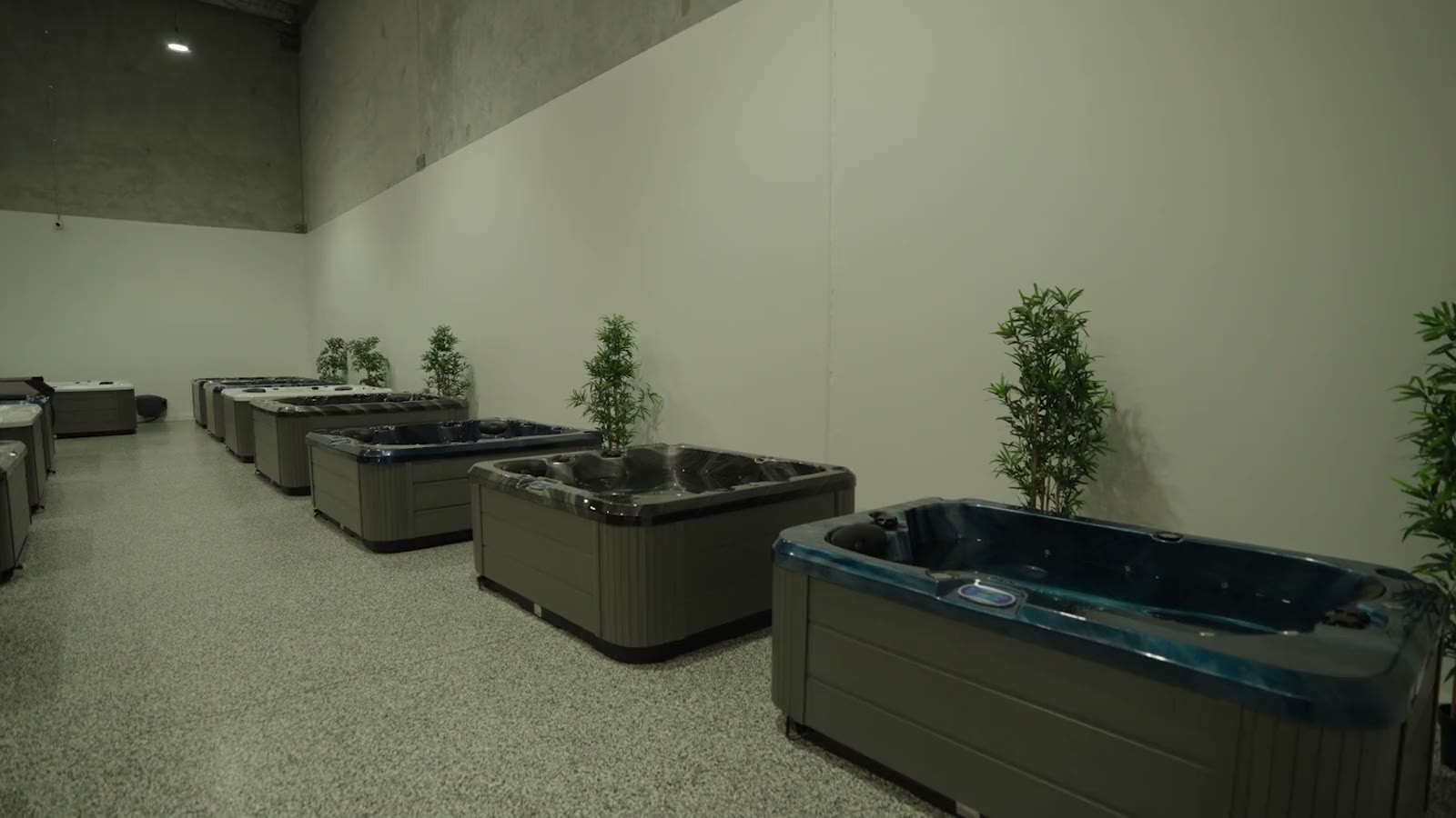 Rows of spas along the wall of the Aqua Pulse Yatala showroom